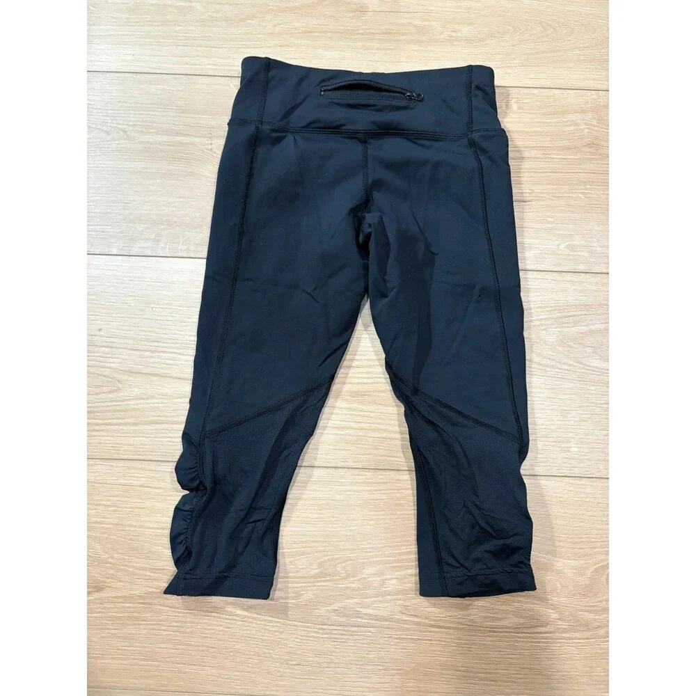 Lululemon Black Run Inspire Crop Leggings Ruched Mesh Size 4 Zipper Pocket Yoga